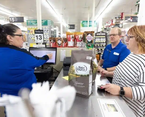 Checking out the pet food at Farm City Supply
