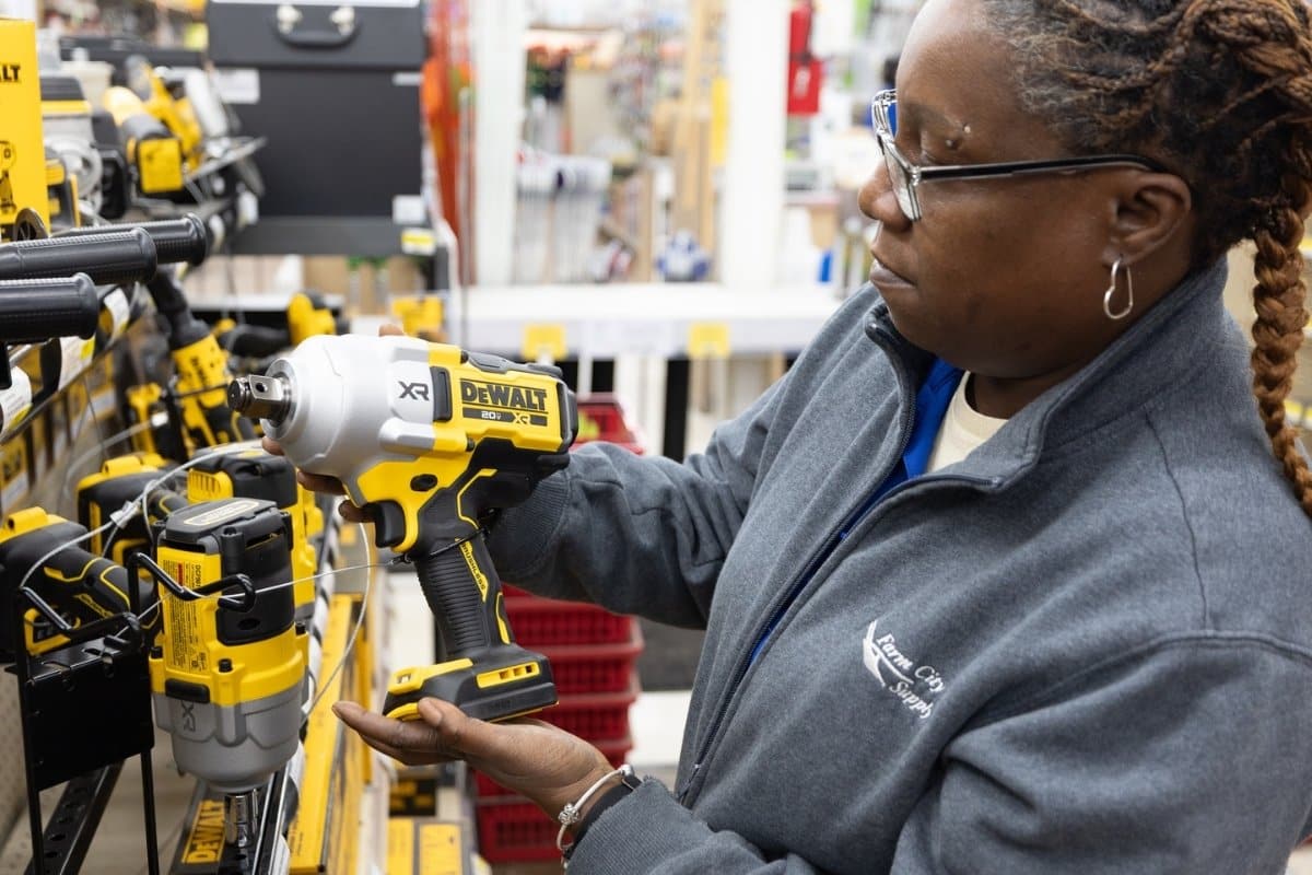 Employee inspecting power tools
