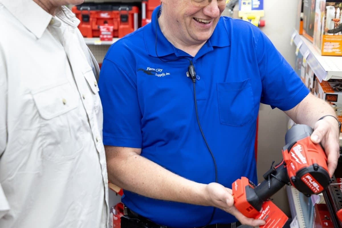 Employee answering customer's questions about tools