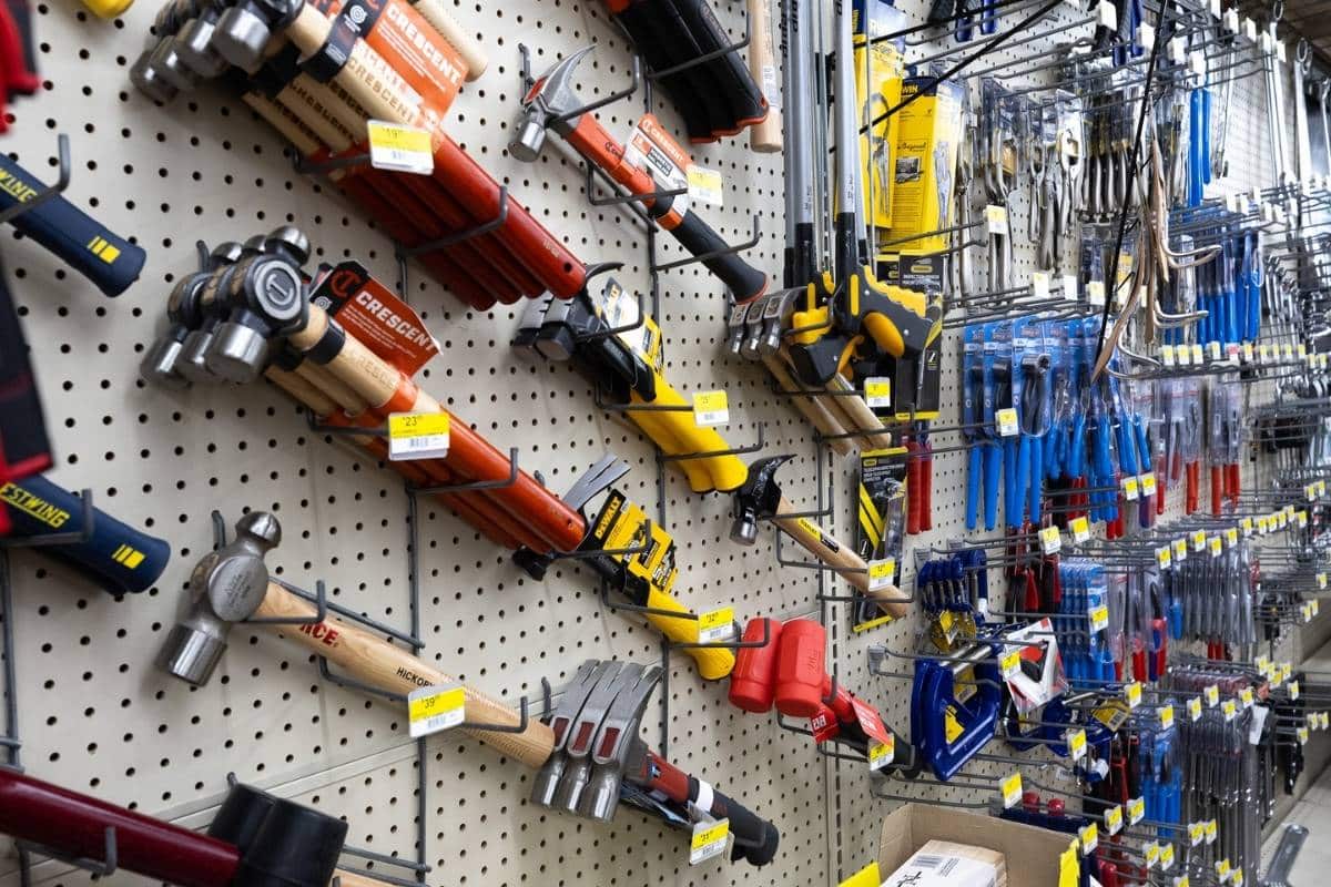 Hand tools and hammers hanging on wall