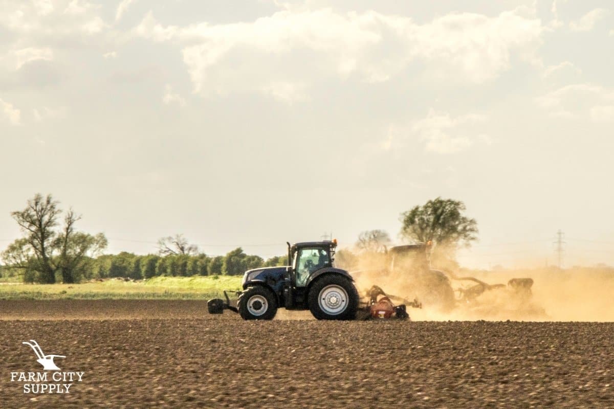 Tractor plowing dirt fields 