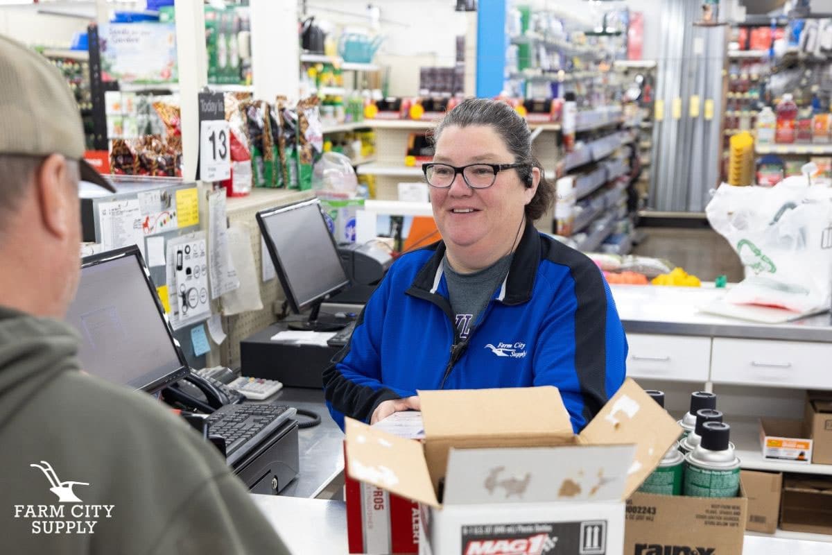 Farm City Supply clerk helping a custom check out