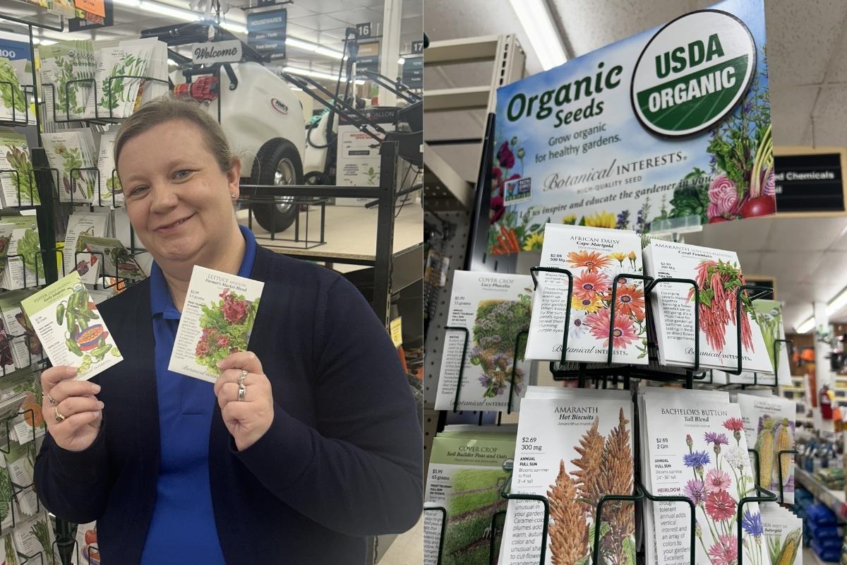 Farm City Supply team member standing beside organic seed displays and vegetable garden seed packets.