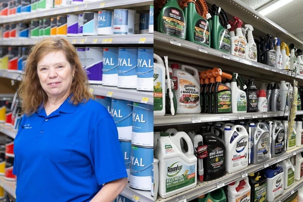 Farm City Supply team member holding vegetable seed packets in front of the garden seed and farm sprayer display